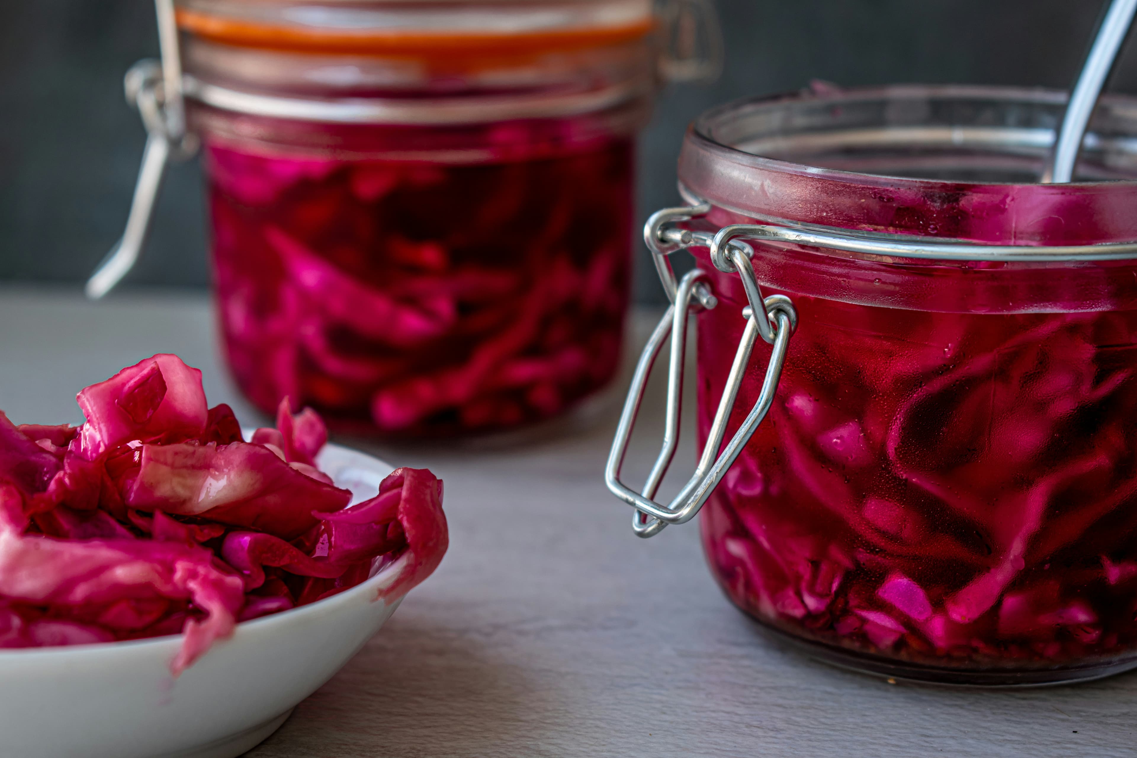 Fermented red cabbage in glass jars — health benefits of probiotic fermented foods